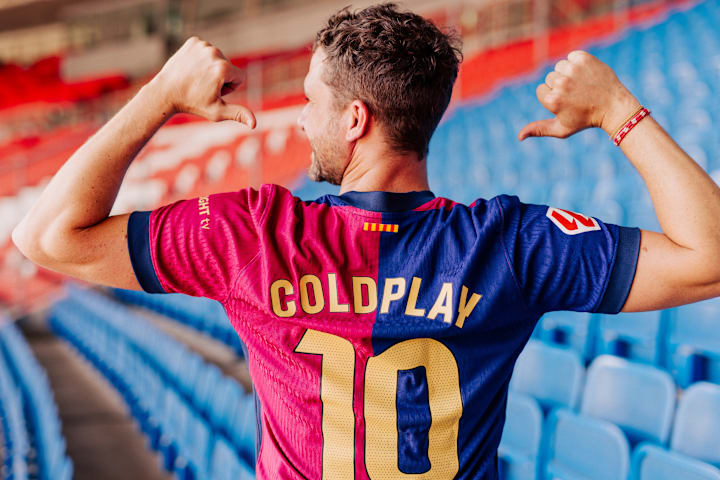 Barcelona's home shirt with Coldplay emblazoned on the back